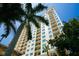 A low angle shot of a high rise with many windows and balconies at 800 N Tamiami Trl # 604, Sarasota, FL 34236