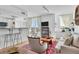 Open living space with views from the lanai and featuring a breakfast bar with seating and elegant decor at 800 N Tamiami Trl # 604, Sarasota, FL 34236