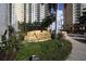Elegant signage for Alinari at Rosemary Place surrounded by manicured greenery at 800 N Tamiami Trl # 604, Sarasota, FL 34236