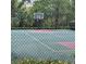 Community basketball court ready for a game, surrounded by trees at 8110 Villa Grande Ct, Sarasota, FL 34243