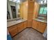 Bathroom featuring dual sinks, tile floor, and cabinetry at 8110 Villa Grande Ct, Sarasota, FL 34243