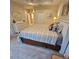 Bright and cozy bedroom with a large bed, dresser, and neutral toned colors at 8110 Villa Grande Ct, Sarasota, FL 34243