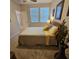 Bedroom featuring carpet, window and furnishings at 8110 Villa Grande Ct, Sarasota, FL 34243