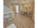 Dining room showcasing a table with seating for four, tile floors, and decorative accents at 8110 Villa Grande Ct, Sarasota, FL 34243