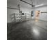 Two car garage featuring shelving for storage, and access door to interior living space at 8110 Villa Grande Ct, Sarasota, FL 34243