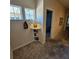 Well-lit hallway with coastal decor and views into the adjacent bedroom at 8110 Villa Grande Ct, Sarasota, FL 34243