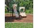 Community playground with slides and climbing features, surrounded by mulch at 8110 Villa Grande Ct, Sarasota, FL 34243