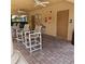 Community pool house with ceiling fans, drinking fountain, emergency phone, and restroom facilities at 8110 Villa Grande Ct, Sarasota, FL 34243
