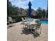 Spend your days by the pool with comfortable lounge seating, tables with umbrellas, and views of the lovely neighborhood at 8110 Villa Grande Ct, Sarasota, FL 34243