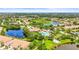 An aerial view of a community clubhouse with a pool and lush landscaping at 8118 Stirling Falls Cir, Sarasota, FL 34243