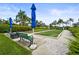 Community bocce ball court with lush landscaping and comfortable seating to enjoy an outdoor activity at 8118 Stirling Falls Cir, Sarasota, FL 34243