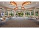 Elegant clubhouse with ample seating, bright lighting, and large windows overlooking the community at 8118 Stirling Falls Cir, Sarasota, FL 34243