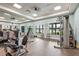 Well-equipped fitness center featuring modern machines, weights, and mirrors for a complete workout at 8118 Stirling Falls Cir, Sarasota, FL 34243