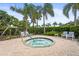 Relaxing hot tub surrounded by lush landscaping and comfortable seating for community residents to enjoy at 8118 Stirling Falls Cir, Sarasota, FL 34243
