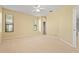 Neutral main bedroom with carpet flooring, ceiling fan, and windows that provide plenty of light at 8118 Stirling Falls Cir, Sarasota, FL 34243