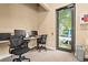 Community office with computers, seating, and natural light for residents to stay connected and productive at 8118 Stirling Falls Cir, Sarasota, FL 34243