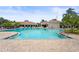 Community pool and clubhouse, inviting residents to relax and enjoy resort-style living at 8118 Stirling Falls Cir, Sarasota, FL 34243