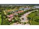 Stunning aerial view of luxury homes nestled around a lake and lush green landscape at 8316 Portlight Ct, Lakewood Ranch, FL 34202