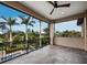 Covered balcony with views of palm trees and the pool area at 8316 Portlight Ct, Lakewood Ranch, FL 34202