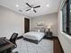 Well-lit bedroom featuring a queen-sized bed and modern decor at 8316 Portlight Ct, Lakewood Ranch, FL 34202