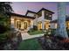A beautiful view of the home's exterior with a covered patio area and landscaped yard at 8316 Portlight Ct, Lakewood Ranch, FL 34202