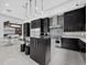 Stylish kitchen with stainless appliances, dark cabinetry, and a functional center island at 8316 Portlight Ct, Lakewood Ranch, FL 34202