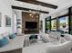 Inviting living room featuring stone accent wall, modern lighting, and comfortable seating at 8316 Portlight Ct, Lakewood Ranch, FL 34202
