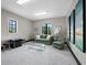 Sitting room with modern art, windows, and furniture at 8316 Portlight Ct, Lakewood Ranch, FL 34202
