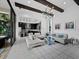 Open living space with kitchen access and modern lighting, perfect for entertaining at 8316 Portlight Ct, Lakewood Ranch, FL 34202