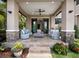 Beautiful outdoor patio with comfortable seating, fireplace and lush landscaping at 8316 Portlight Ct, Lakewood Ranch, FL 34202