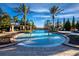 Community pool with zero depth entry, water features and mature palm trees at 8316 Portlight Ct, Lakewood Ranch, FL 34202