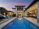 Beautiful backyard pool and spa with sun loungers and outdoor dining area on a covered patio at 8316 Portlight Ct, Lakewood Ranch, FL 34202