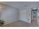 Minimalist bedroom with carpet, neutral walls, a closet, and access to the hall at 904 Winter Garden Dr, Sarasota, FL 34243