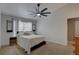 Bright bedroom features neutral tones, a ceiling fan, and ample natural light at 904 Winter Garden Dr, Sarasota, FL 34243
