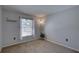 Simple bedroom with a window and hardwood floors at 904 Winter Garden Dr, Sarasota, FL 34243
