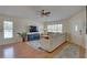 Bright and spacious living room with hardwood floors, a sectional sofa, and ample natural light at 904 Winter Garden Dr, Sarasota, FL 34243