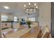 Spacious living area with open layout, modern lighting, and seamless flow to the kitchen at 904 Winter Garden Dr, Sarasota, FL 34243