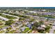 Aerial view of neighborhood with waterways, ponds and lush greenery at 913 64Th W St, Bradenton, FL 34209