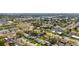 Aerial view of a community featuring homes with mature trees and a pond at 913 64Th W St, Bradenton, FL 34209