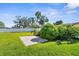 Beautiful backyard featuring a well-manicured lawn and lush landscaping at 913 64Th W St, Bradenton, FL 34209