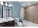 Updated bathroom with modern vanity and tiled shower at 913 64Th W St, Bradenton, FL 34209