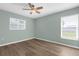 Inviting bedroom with abundant natural light, vinyl flooring, and two windows at 913 64Th W St, Bradenton, FL 34209