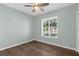 Bedroom features hardwood floors, a neutral paint color, and a window at 913 64Th W St, Bradenton, FL 34209