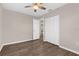 Bedroom with hardwood floors, closet and open door to bath at 913 64Th W St, Bradenton, FL 34209