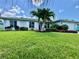 Charming single Gathering home with lush green lawn and well manicured landscaping at 913 64Th W St, Bradenton, FL 34209