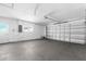 Spacious garage featuring concrete floors and an automatic garage door at 913 64Th W St, Bradenton, FL 34209