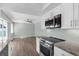 Modern kitchen featuring stainless steel appliances and white cabinets at 913 64Th W St, Bradenton, FL 34209