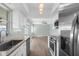 Well-lit kitchen featuring granite countertops and stainless steel appliances at 913 64Th W St, Bradenton, FL 34209