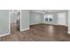 Bright living room featuring hardwood floors, ceiling fan, and large windows at 913 64Th W St, Bradenton, FL 34209