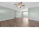 Spacious living room features modern ceiling fan and beautiful wood-look vinyl flooring at 913 64Th W St, Bradenton, FL 34209